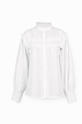 Bluse i brodert mønster