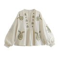 Brodert bluse med løs passform